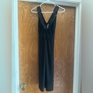 Black dress, jersey like stretchy material, sequin trim around neck